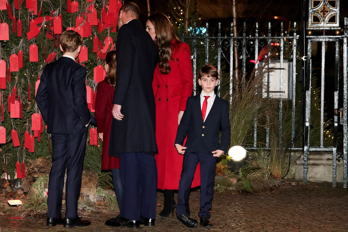 Prince Louis, who wrote a note to his grandparents, at the Together at Christmas 'Kindness Tree' with the Walees family