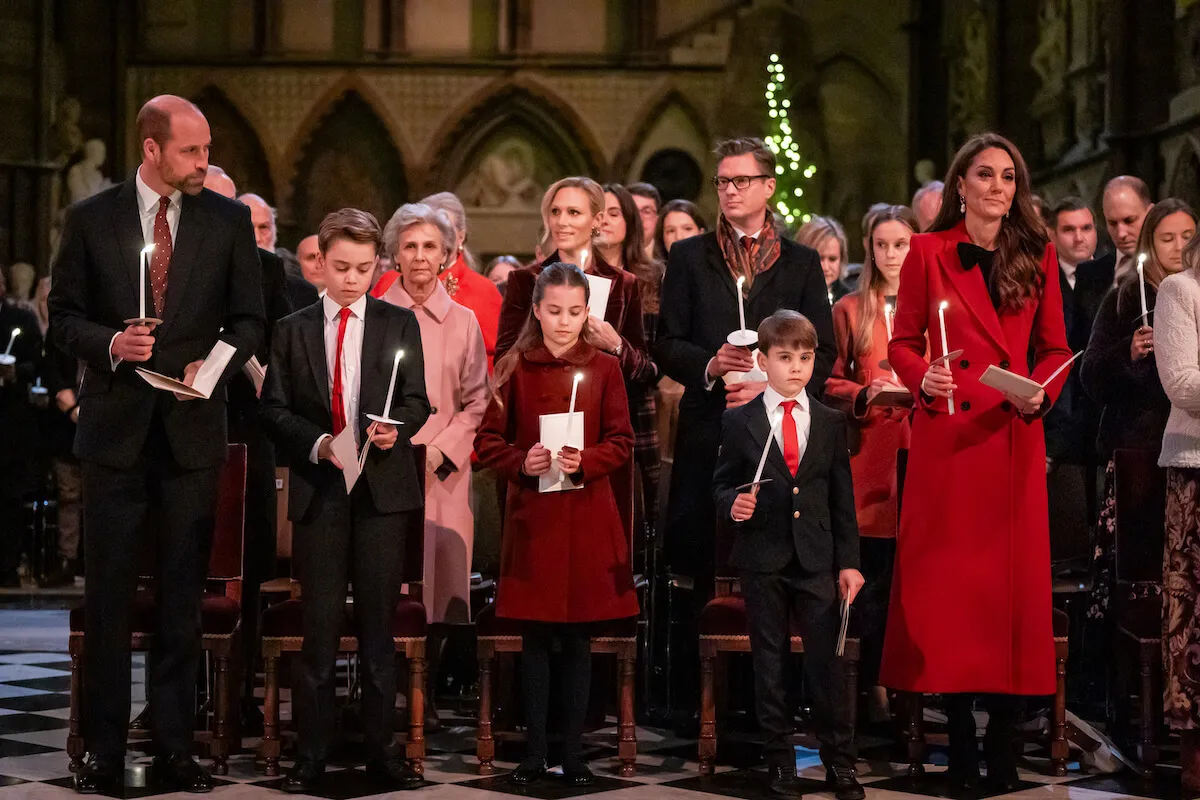 Prince William, Prince George, Princess Charlotte, Prince Louis, who wrote a note for his grandparents at the Together at Christmas concert, and Kate Middleton