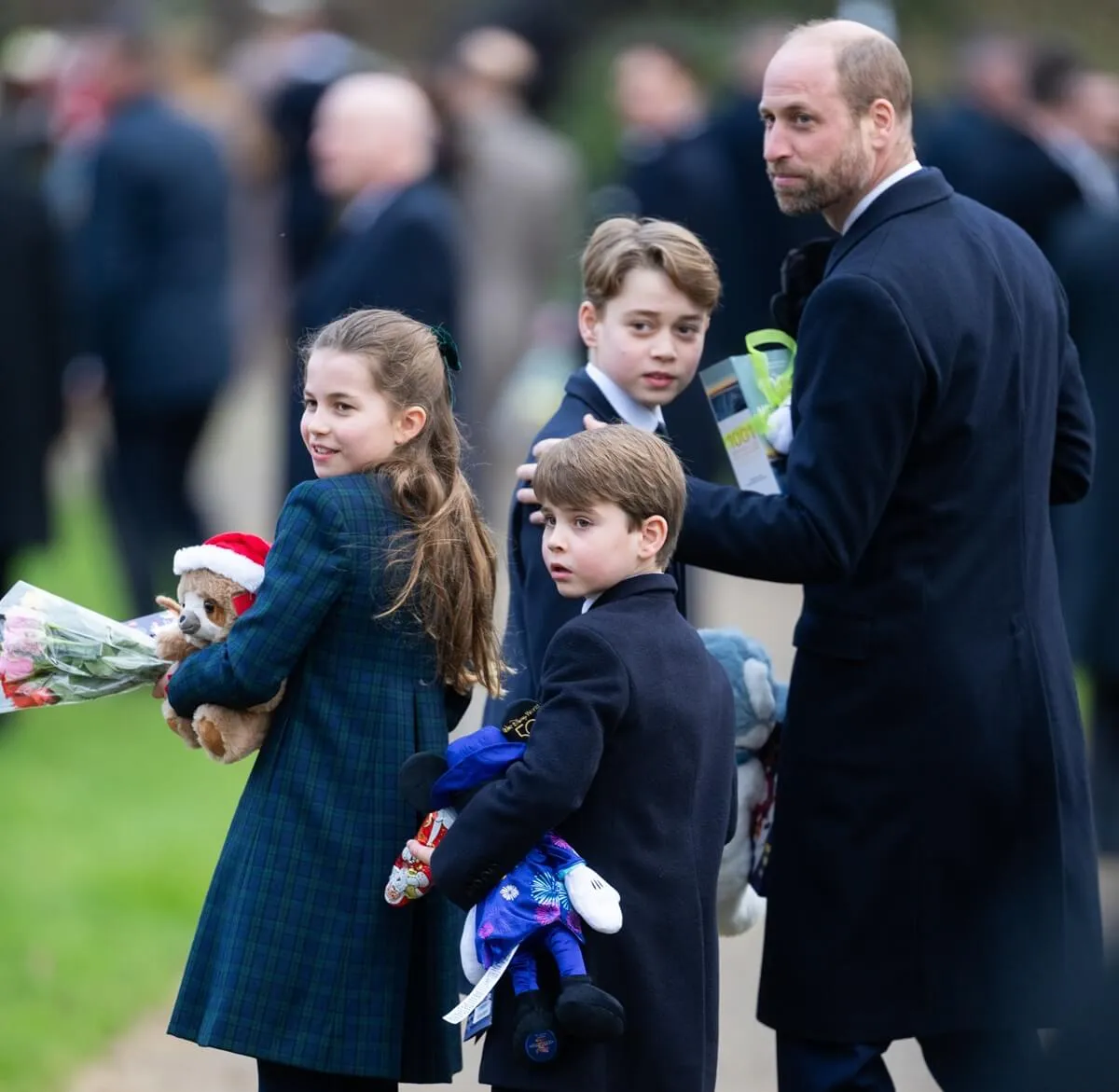 Princess Charlotte, Prince Louis, Prince George, and Prince William following the Christmas Morning service and walkabout at Sandringham