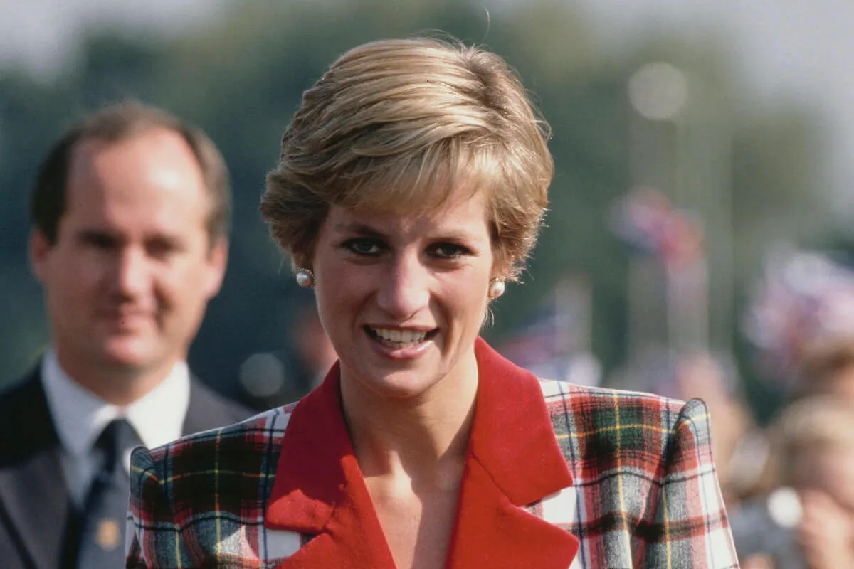 Princess Diana, who used to do Christmas shopping when stores were closed, wears plaid.