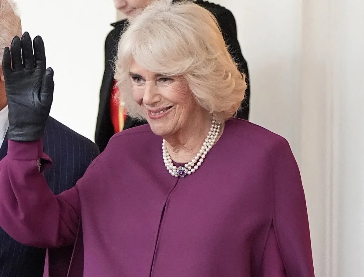 Queen Camilla waves goodbye as she bids farewell to Qatar's Emir Sheikh Tamim bin Hamad al-Thani and his wife