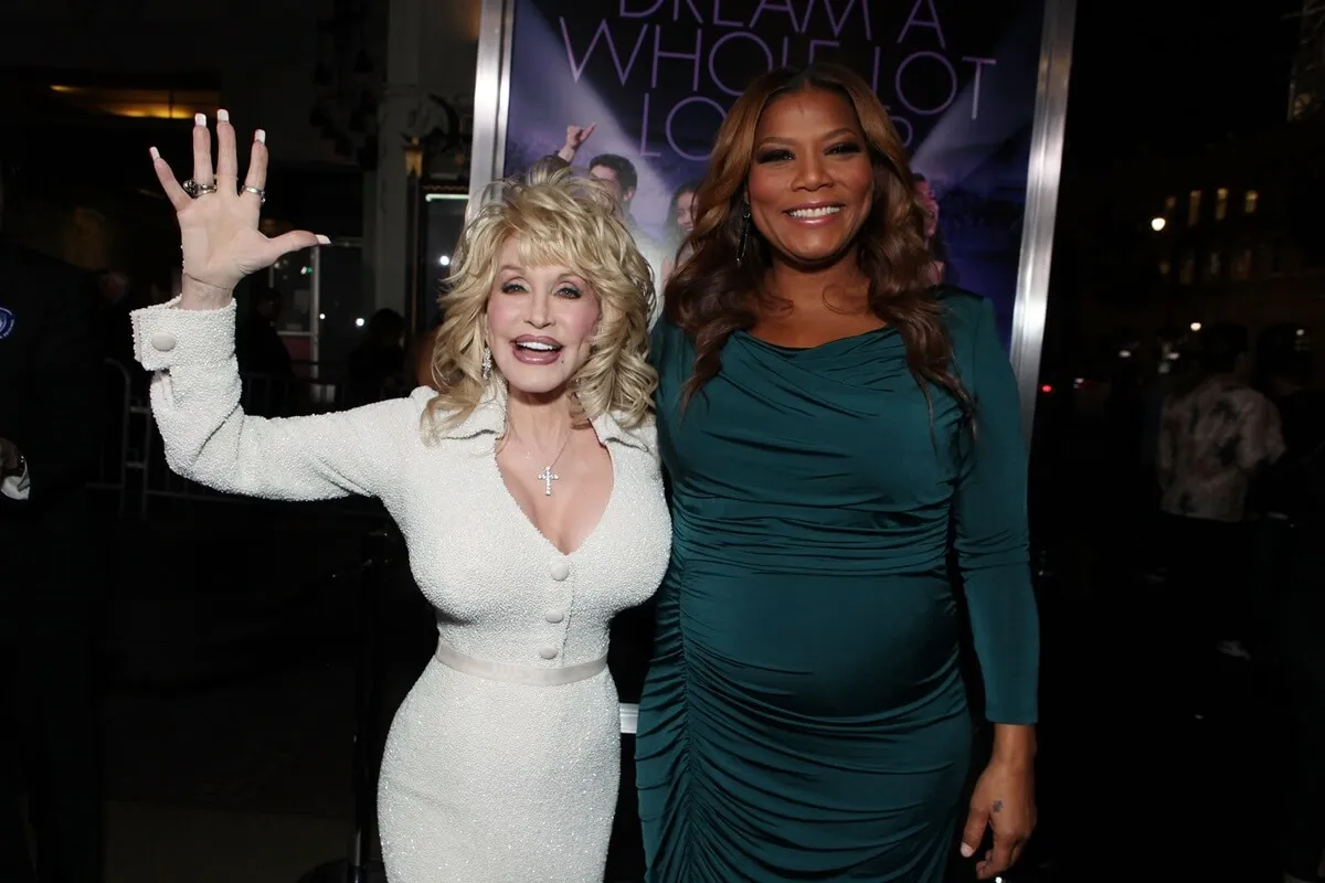 Dolly Parton and Queen Latifah at Warner Bros. World Premiere of "Joyful Noise" in a white and green dress respectively.