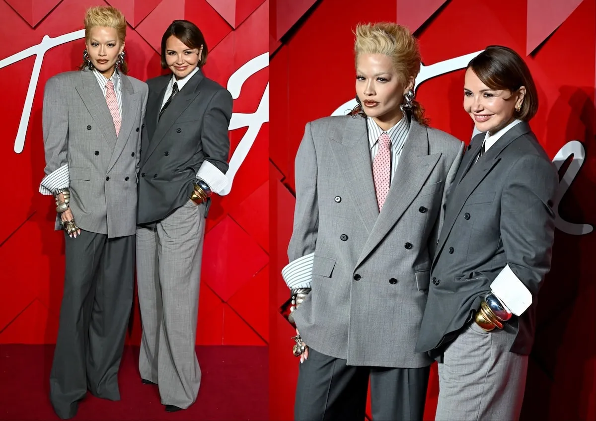 Wearing a gray oversized suit and blonde mullet, Rita Ora poses with her mom for photos on the red carpet before The British Fashion Awards 2024