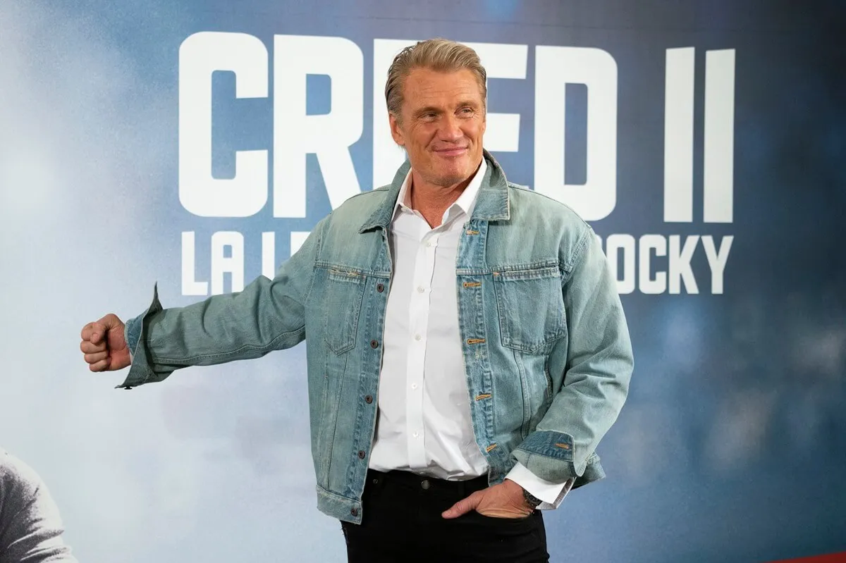 Dolph Lundgren posing at the 'Creed II' premiere in a jean jacket.