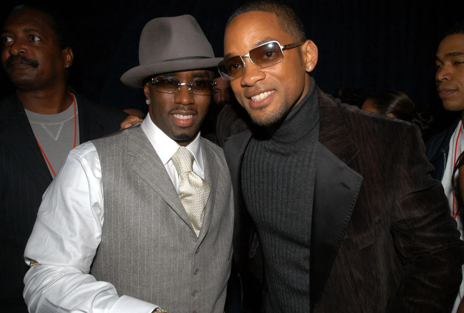 Sean 'Diddy' Combs and Will Smith smiling and posing next to each other in 2003