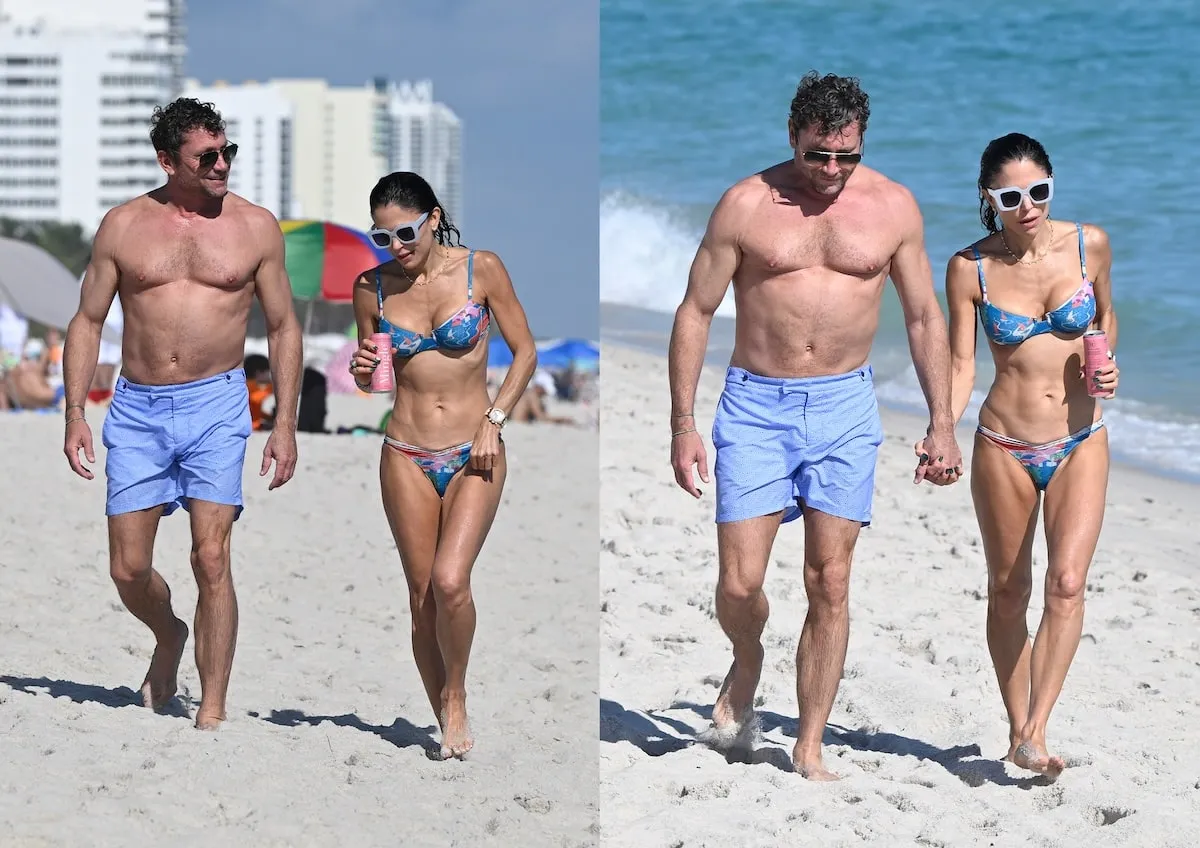 Wearing a blue floral bikini, Bethanny Frankel walks on a Miami beach with her boyfriend, Tom Villante