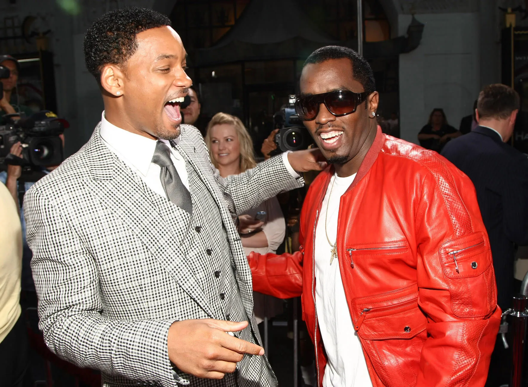 Will Smith smiling with his hand on Sean 'Diddy' Combs' shoulder while Combs smiles