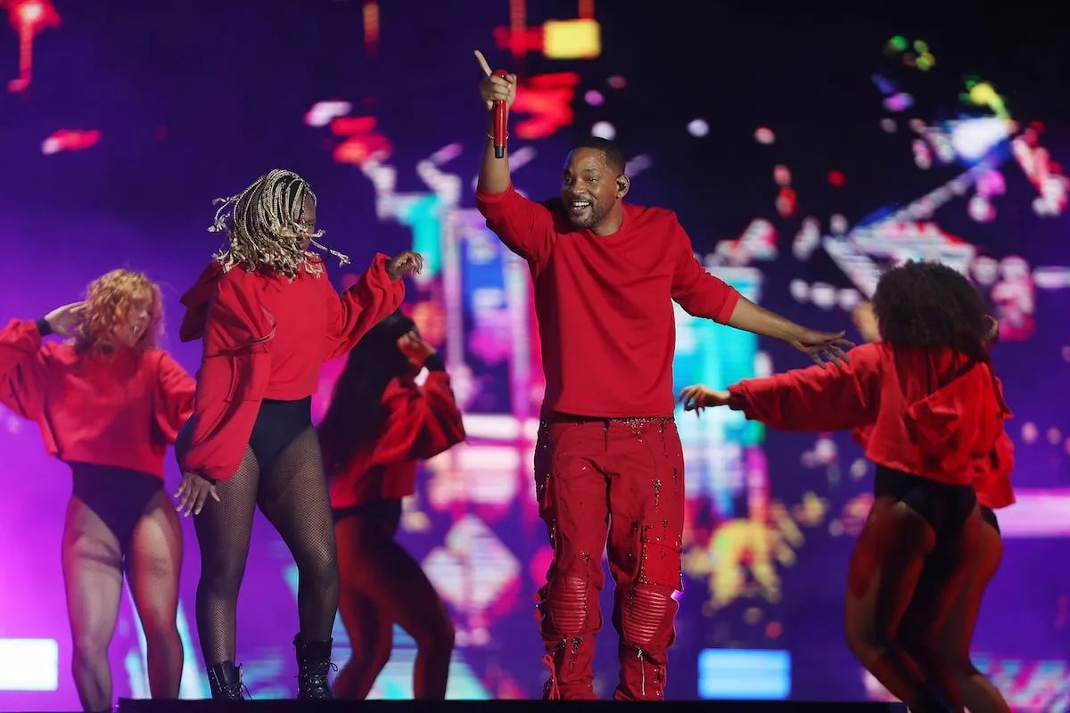 Wearing an all-red outfit, Will Smith sings and raps at the Rock In Rio Festival