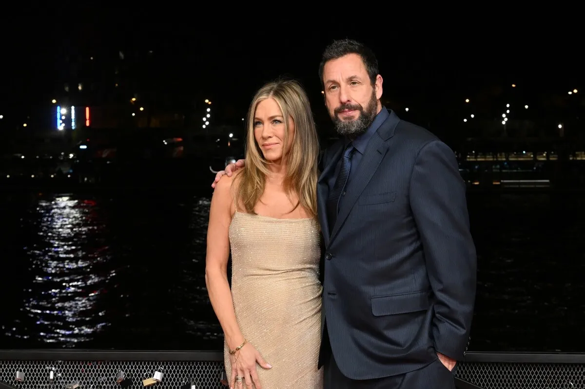 Adam Sandler and Jennifer Aniston posing alongside each other for the 'Murder Mystery 2' photocall.