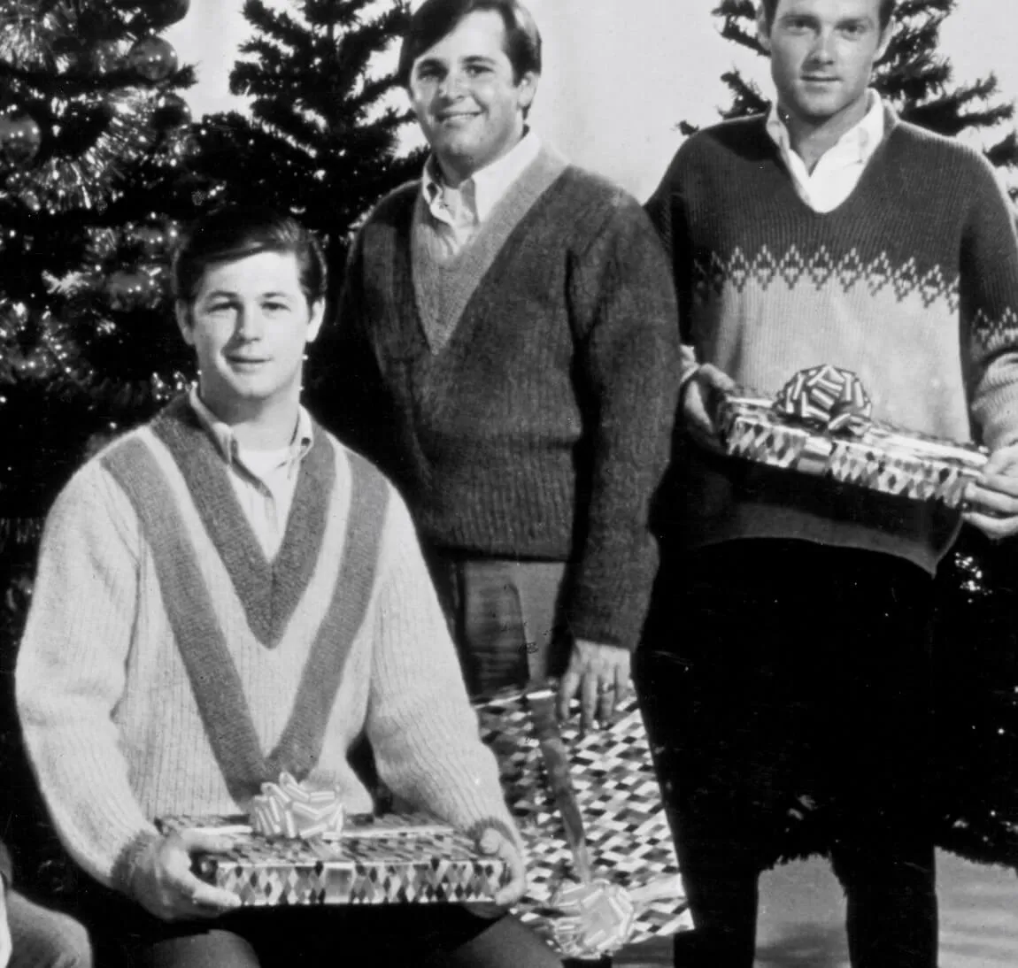 Members of "Little Saint Nick" band The Beach Boys with Christmas trees