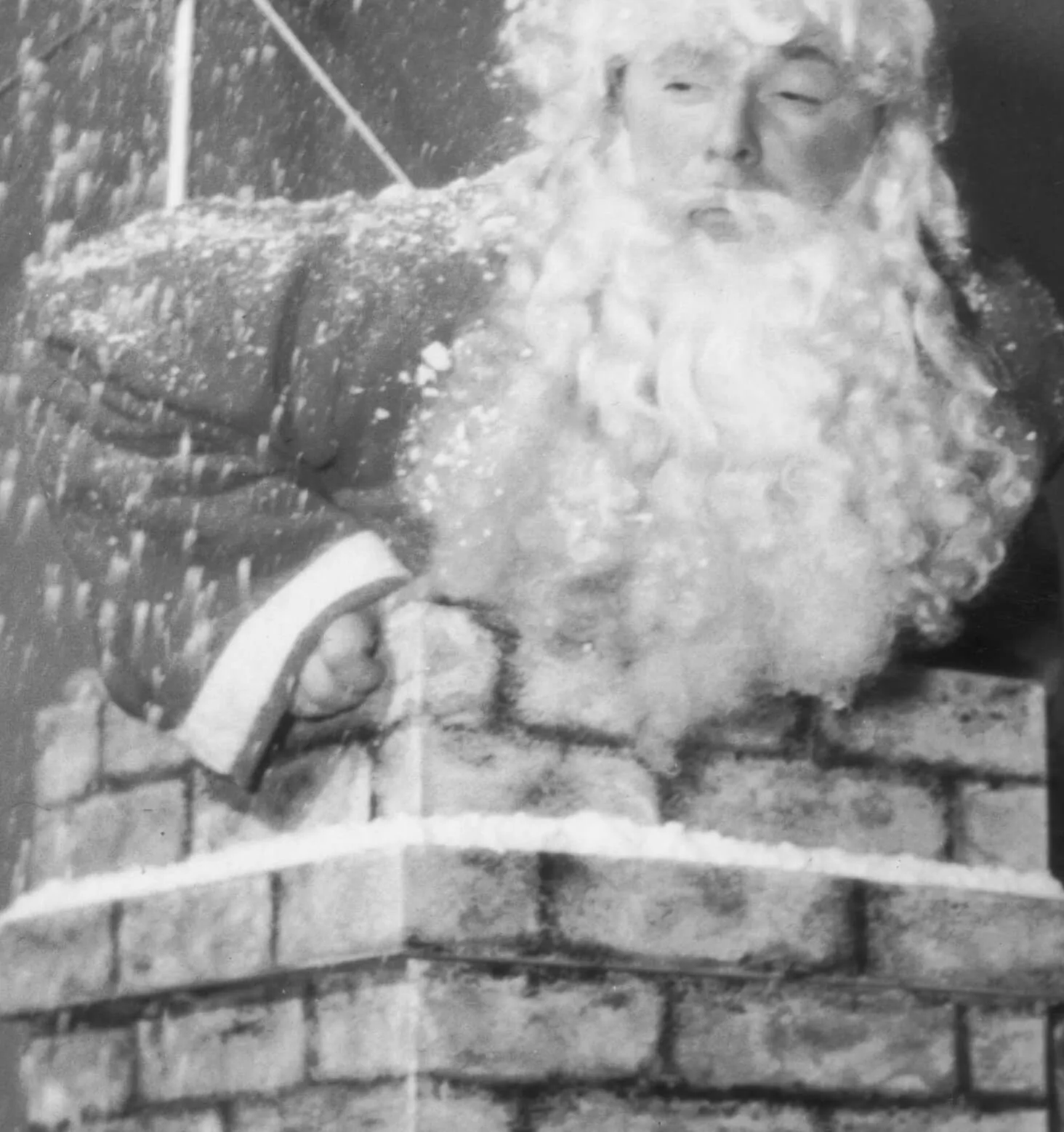 A black-and-white image of Santa Claus