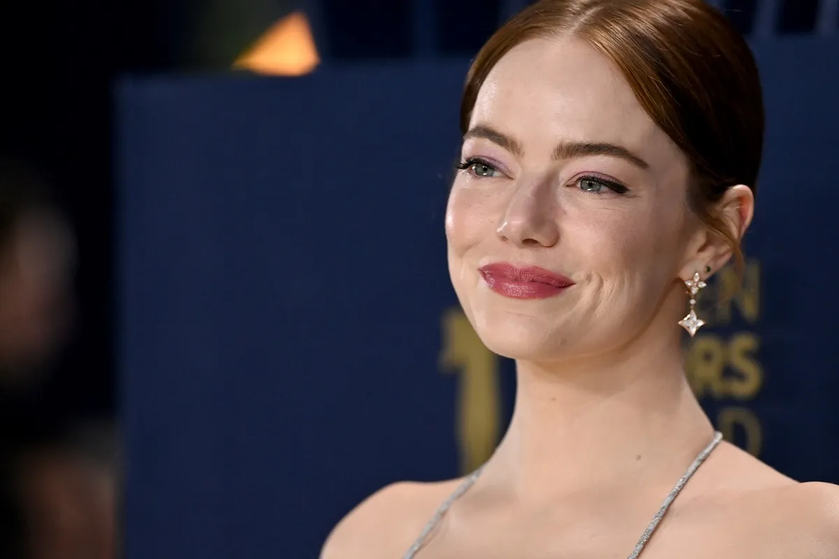 Emma Stone smiling in a dress at the Screen Actors Guild Awards.