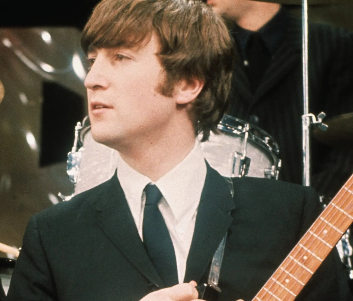 John Lennon wearing a suit