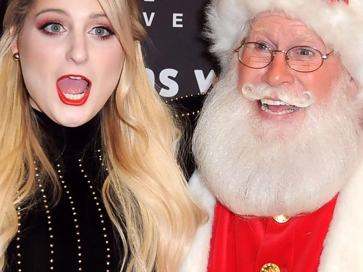 Meghan Trainor with a man dressed as Santa Claus