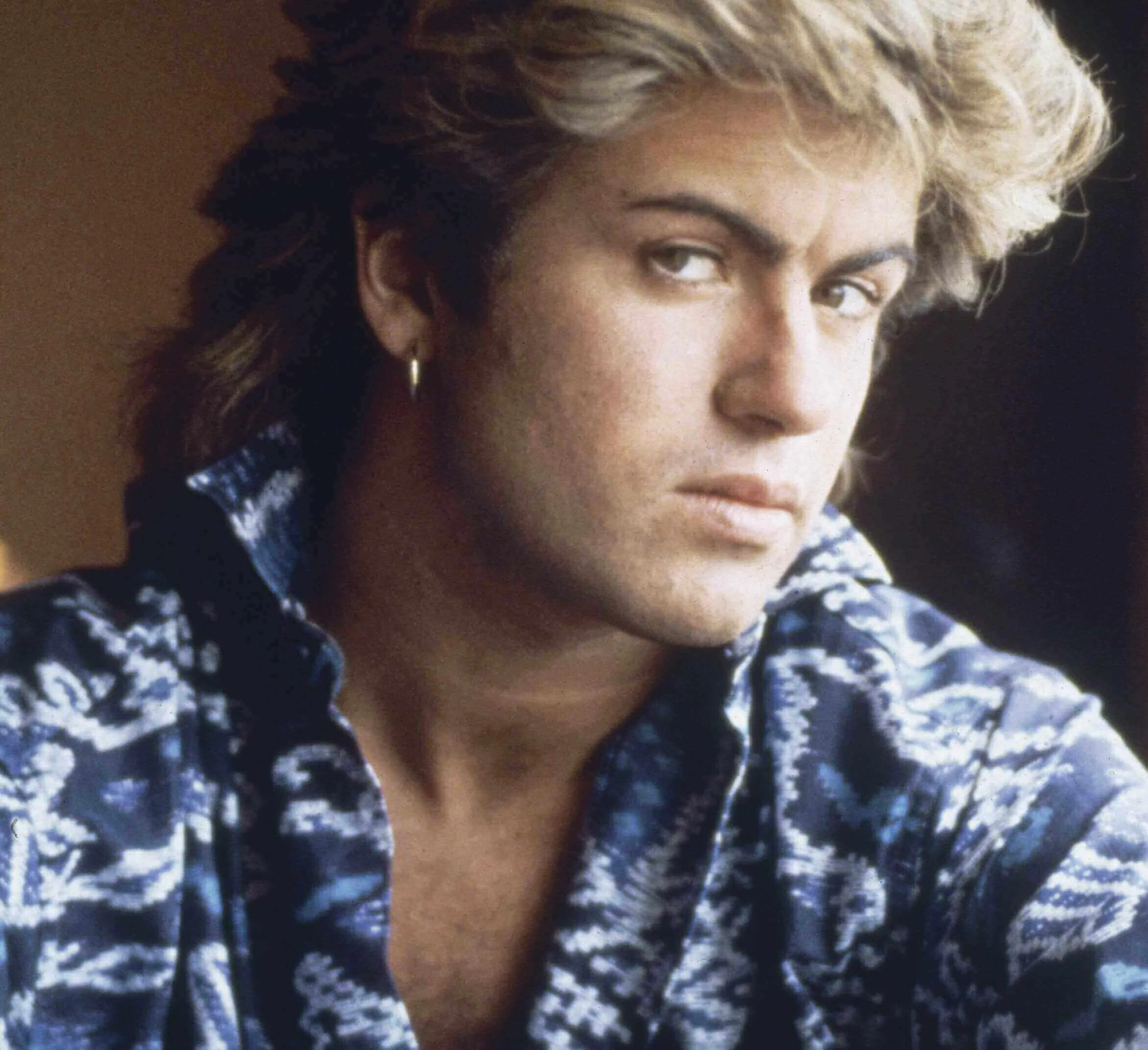 "Last Christmas" singer George Michael of Wham! wearing blue