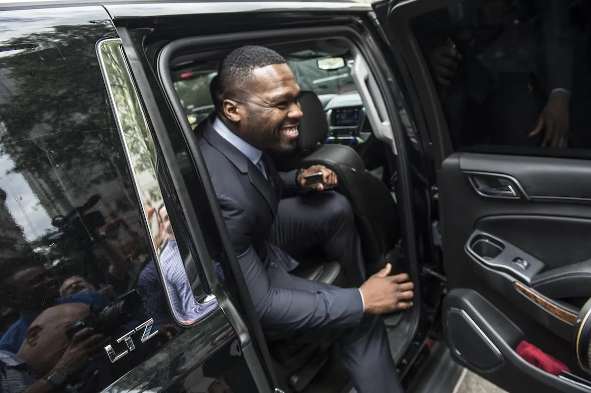 Smile while getting into his car, Curtis Jackson III, aka 50 Cent, leaves Manhattan Supreme Court on Tuesday, July 21, 2015