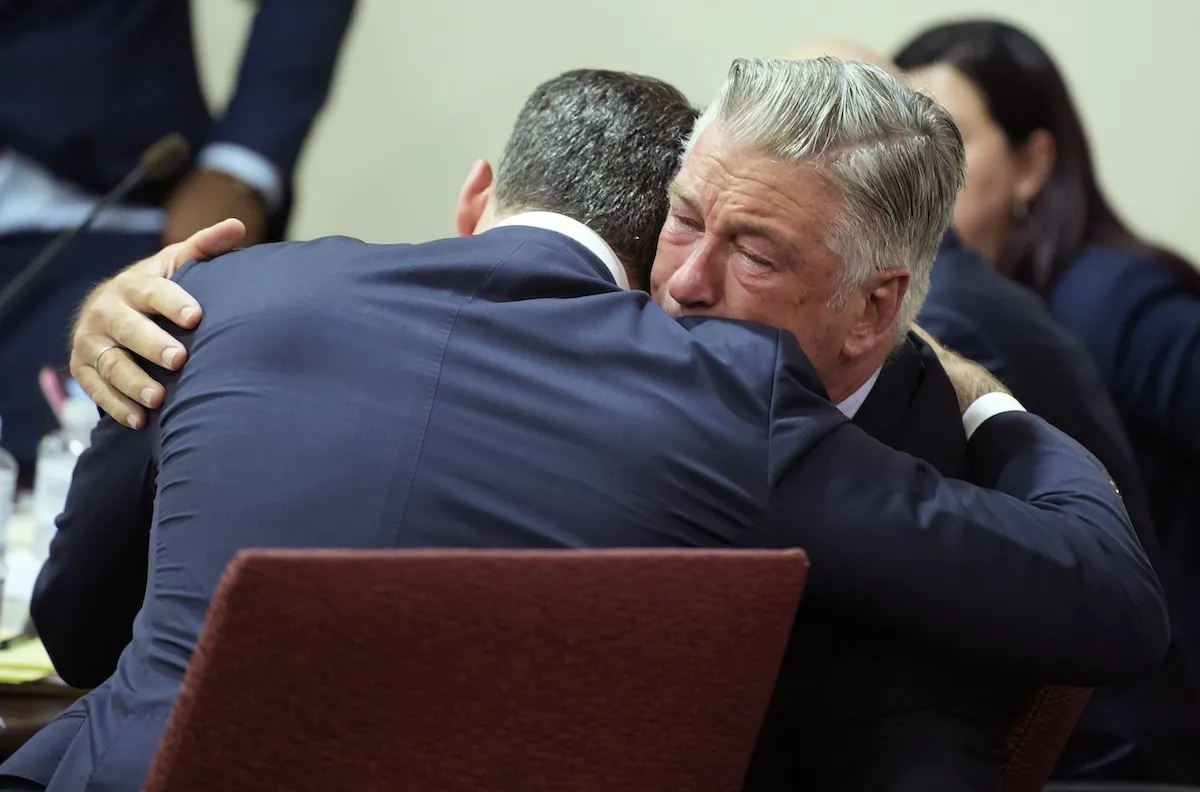 Alec Baldwin embraces his lawyer in court