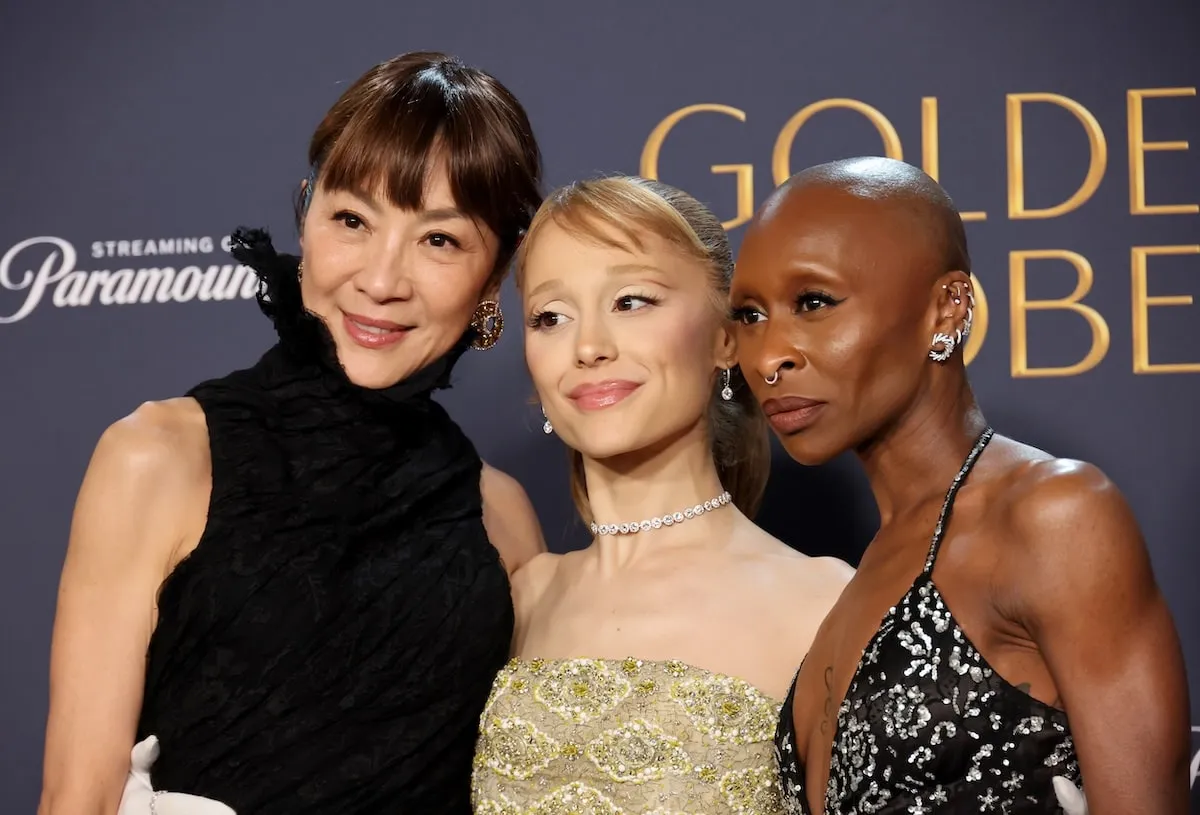 Wearing formalwear, Michelle Yeoh, Ariana Grande, and Cynthia Erivo pose in the press room during the 82nd Annual Golden Globe Awards