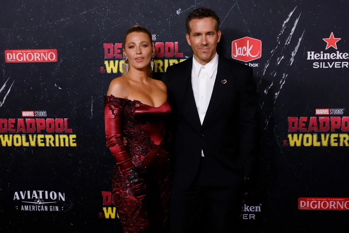 Blake Lively and Ryan Reynolds posing at the premiere of 'Deadpool & Wolverine'.