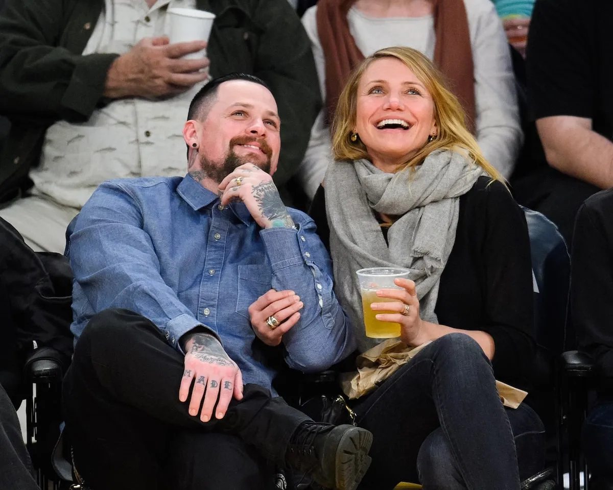 Benji Madden and Cameron Diaz sit courtside at a 2015 NBA game