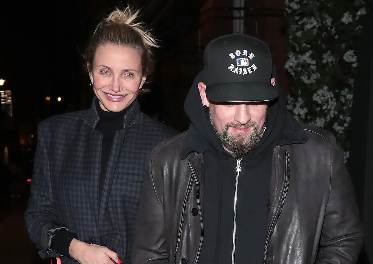 Dressed in all black, Cameron Diaz and Benji Madden dodge the paparazzi outside of a London restaurant