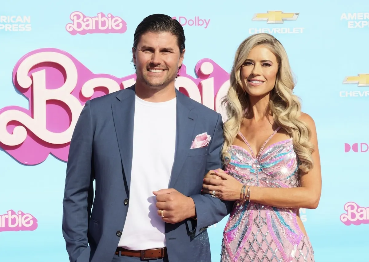 Wearing a pink dress, Christina Hall attends the World Premiere of "Barbie" with then-husband Josh Hall