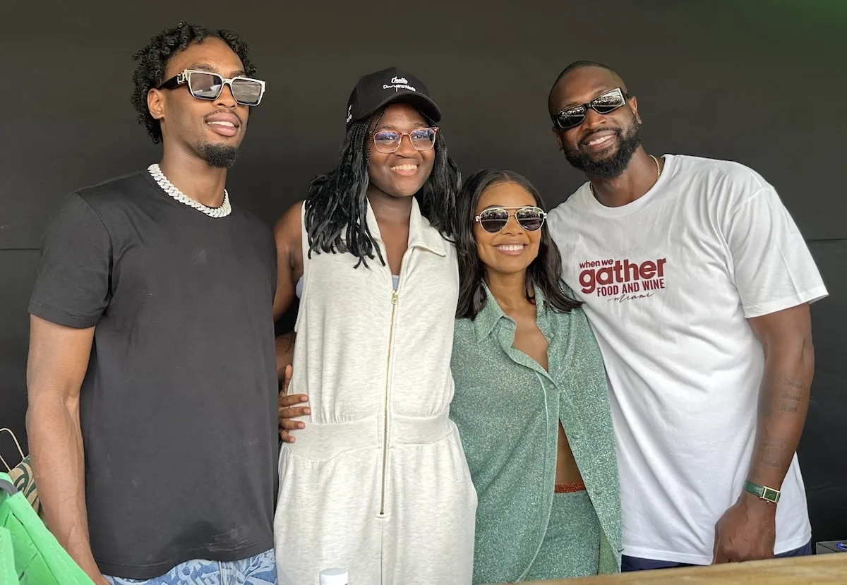 Family members Zaire Wade, Zaya Wade, Gabrielle Union, and Dwyane Wade smile together at a 2024 Miami event