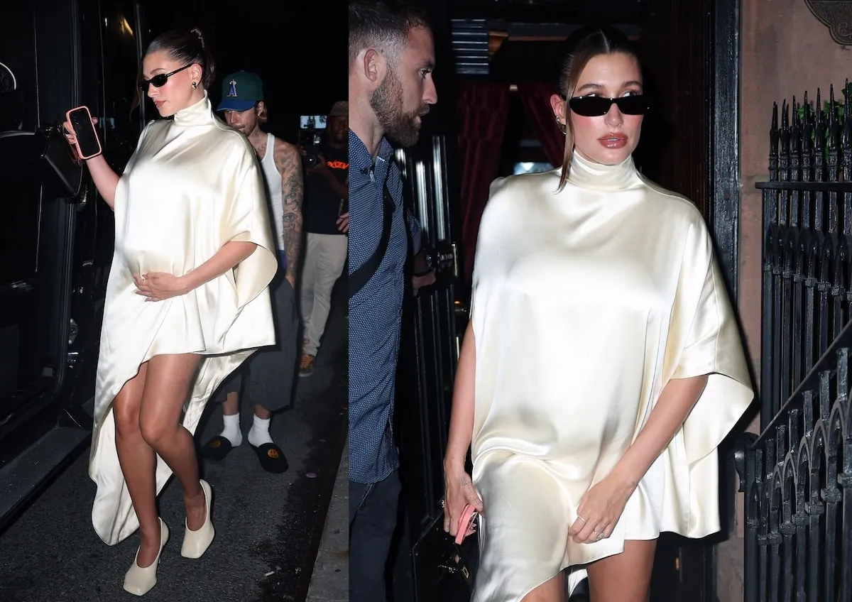 Wearing a cream silk dress, Hailey Bieber leaves a dinner while cradling her babu bump