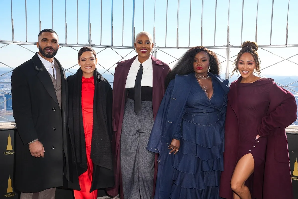 Harlem stars Tyler Lepley, Shoniqua Shandai, Jerrie Johnson, Grace Byers, and Meagan Good pose for a photo inside the Empire State Building