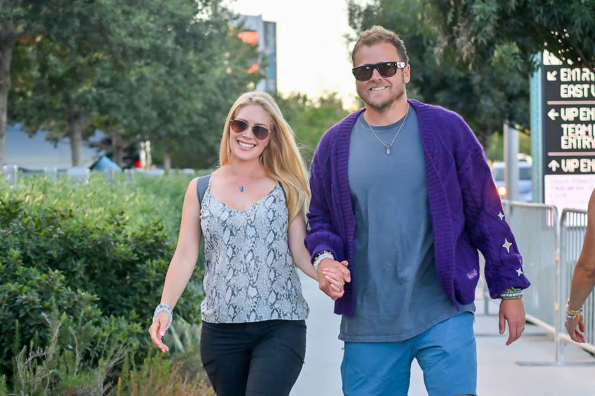 Heidi Montag and Spencer Pratt, who lost their home in the L.A. wildfires, hold hands.