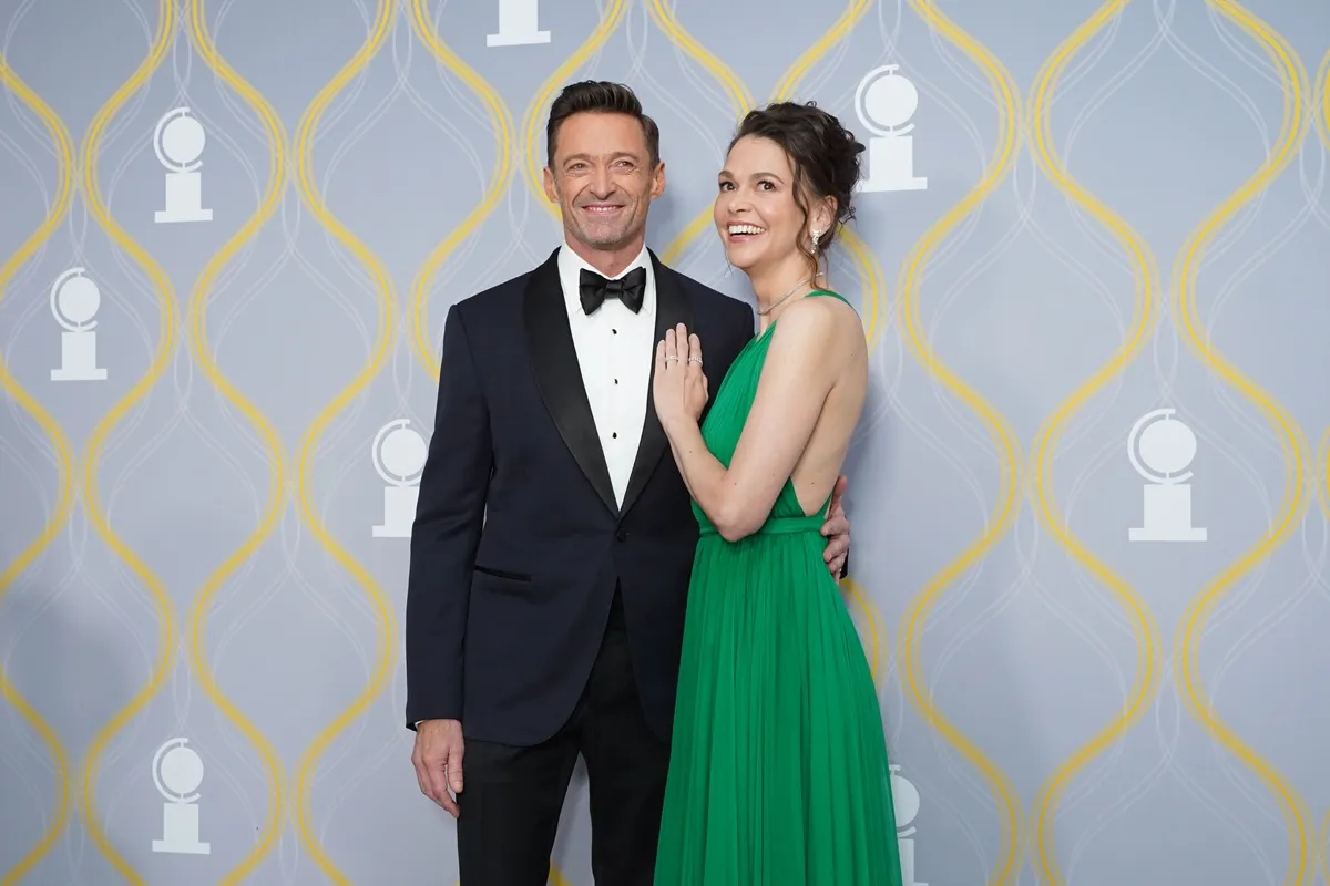 Hugh Jackman and Sutton Foster attend The 75th Annual Tony Awards in a suit and dress respectively.