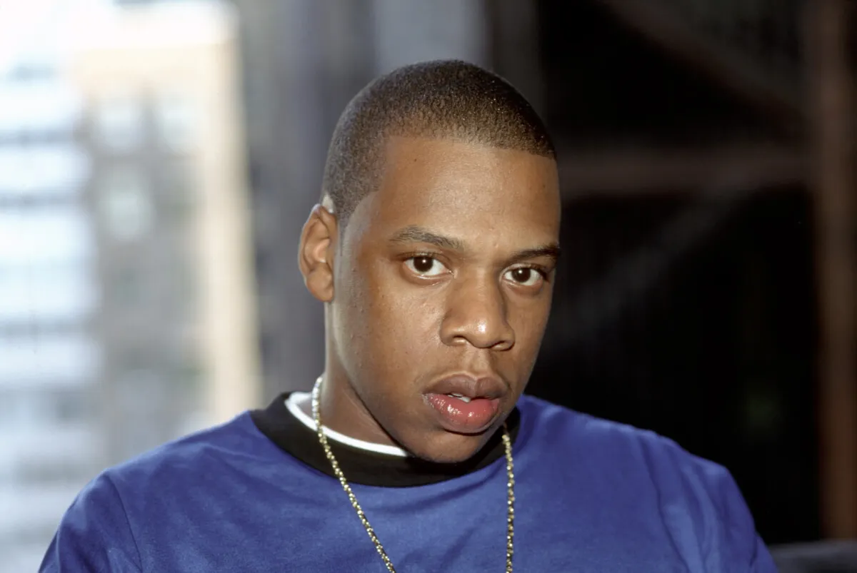 Jay-Z wears a blue shirt.