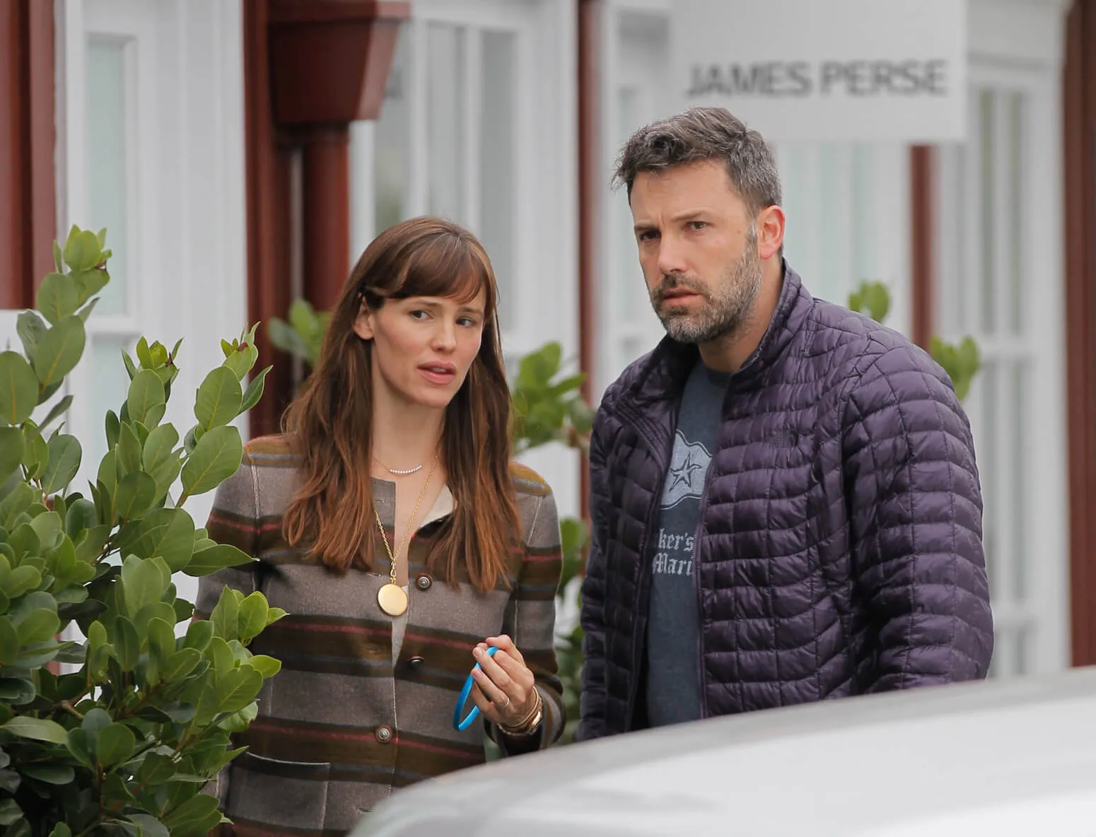 Jennifer Garner and Ben Affleck looking concerned as they stand behind a car in Brentwood, Los Angeles