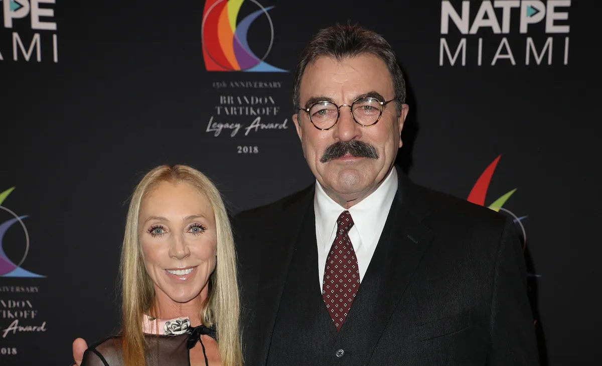 Tom Selleck poses for a photo with his arm around wife Jillie Mack