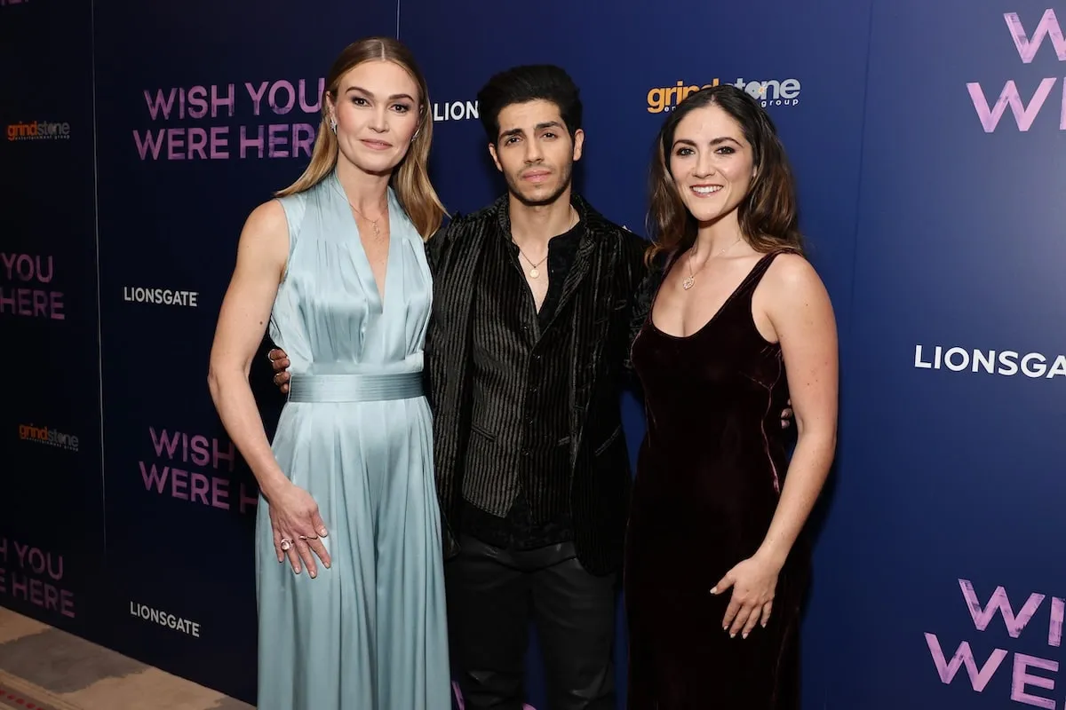 Director Julia Stiles smiles with her cast, Mena Massoud and Isabelle Fuhrman, at a screening of Wish You Were Here