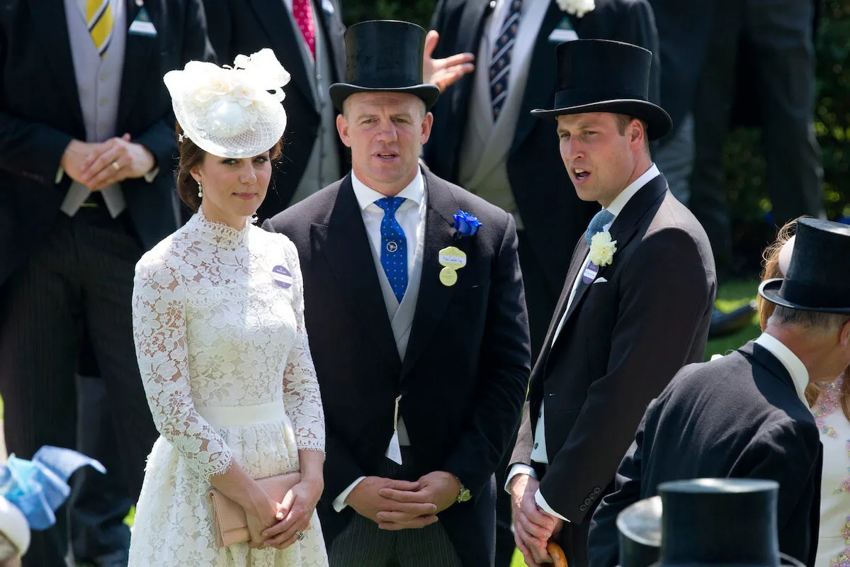 Kate Middleton, Mike Tindall, and Prince William stand next to each other.