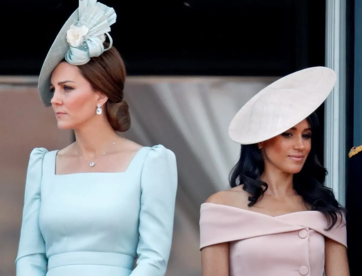 Kate Middleton and Meghan Markle standing on the balcony of Buckingham Palace during Trooping The Colour 2018