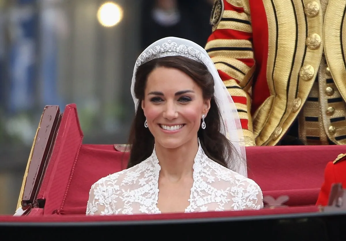 Kate Middleton during the carriage procession on her wedding day wearing the Cartier Halo Tiara