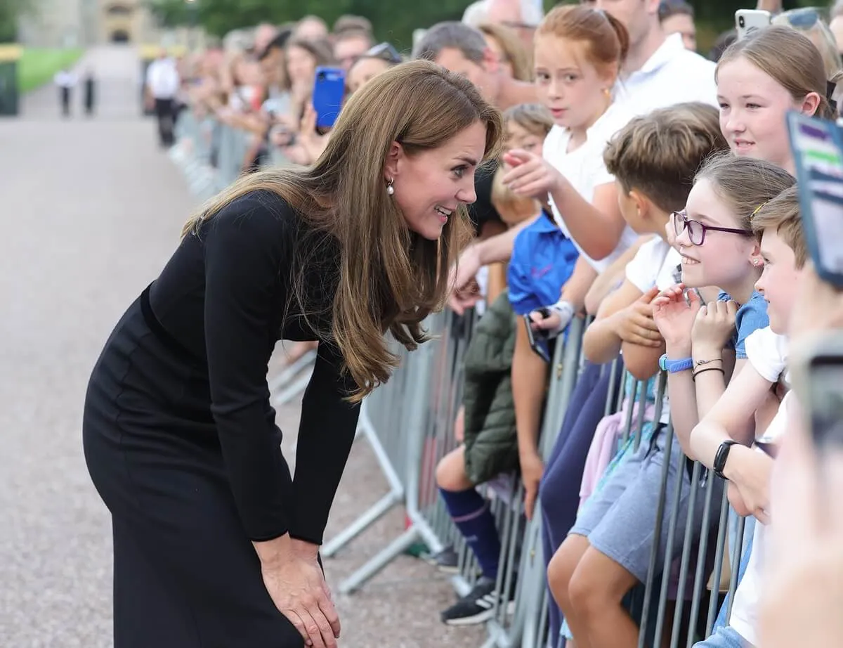 Kate Middleton meets members of the public on the Long Walk at Windsor Castle arrive to view flowers and tributes to Queen Elizabeth II