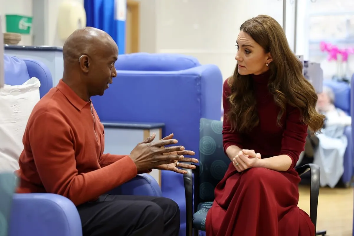 Kate Middleton talks with Peter Burton during a visit to The Royal Marsden Hospital in London, England