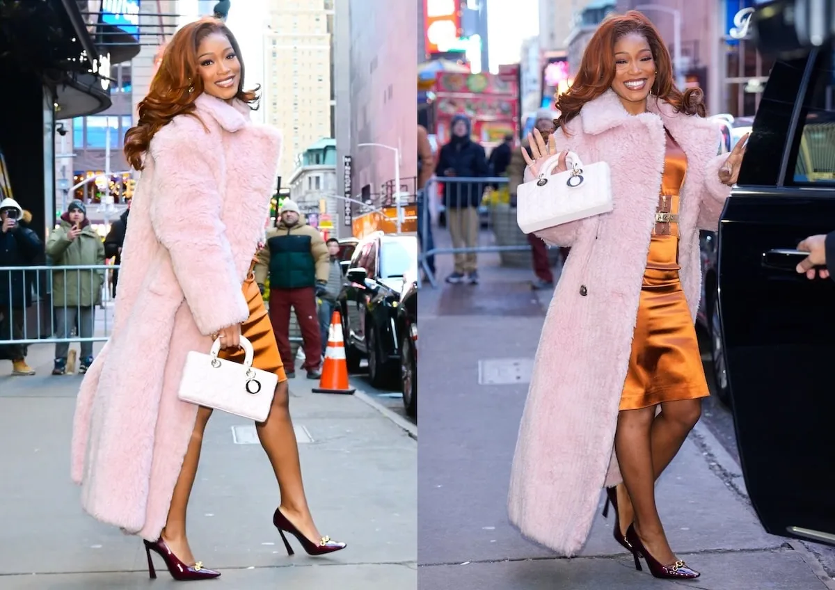 Wearing a pink furry coat, Keke Palmer smiles at paparazzi while exiting GMA Studios in NYC