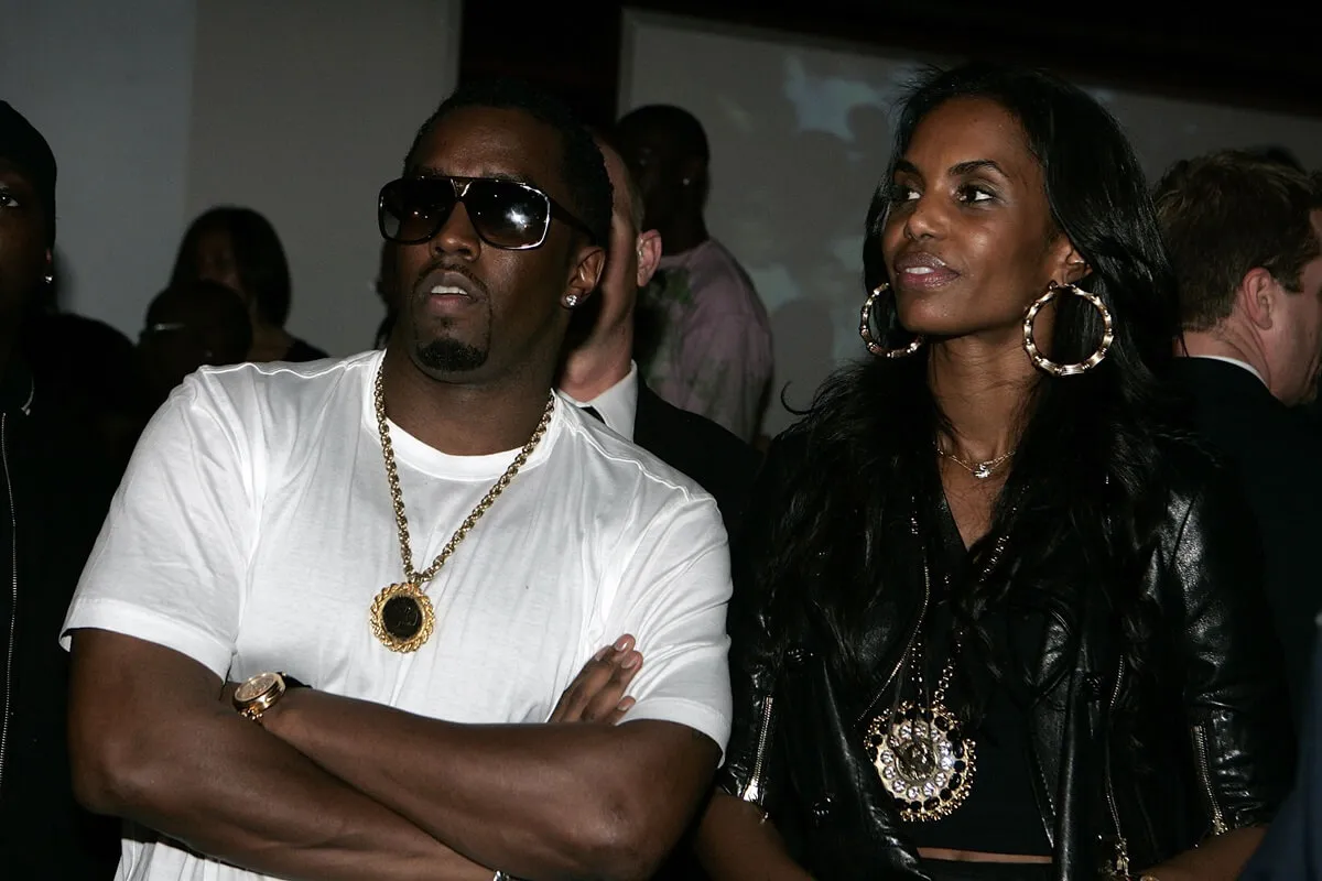 Sean 'Diddy' Combs and Kim Porter posing at Quincy Brown's Stunna 16 Birthday Celebration.