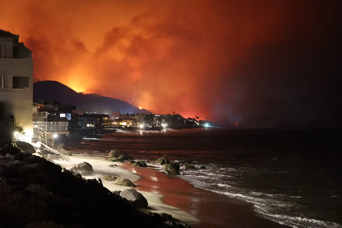 A view of the coast as flames rage across Los Angeles, California, United States on January 09, 2025