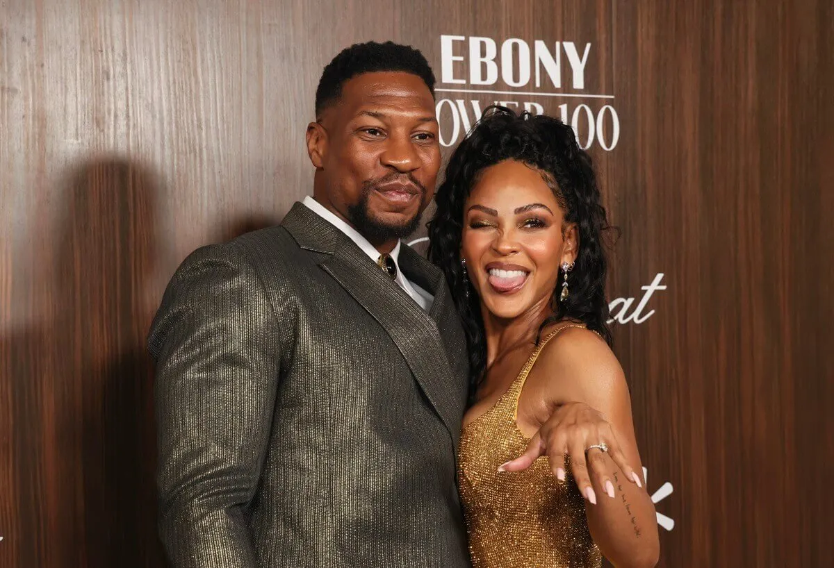 Jonathan Majors posing alongside Meagan Good at the 2024 Ebony Power 100 List at Nya Studios.