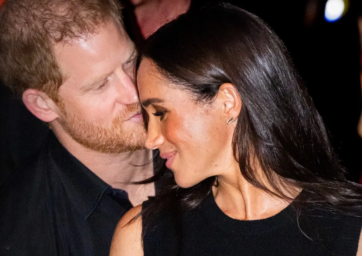 Prince Harry kisses Meghan Markle on the cheek at a 2023 basketball game