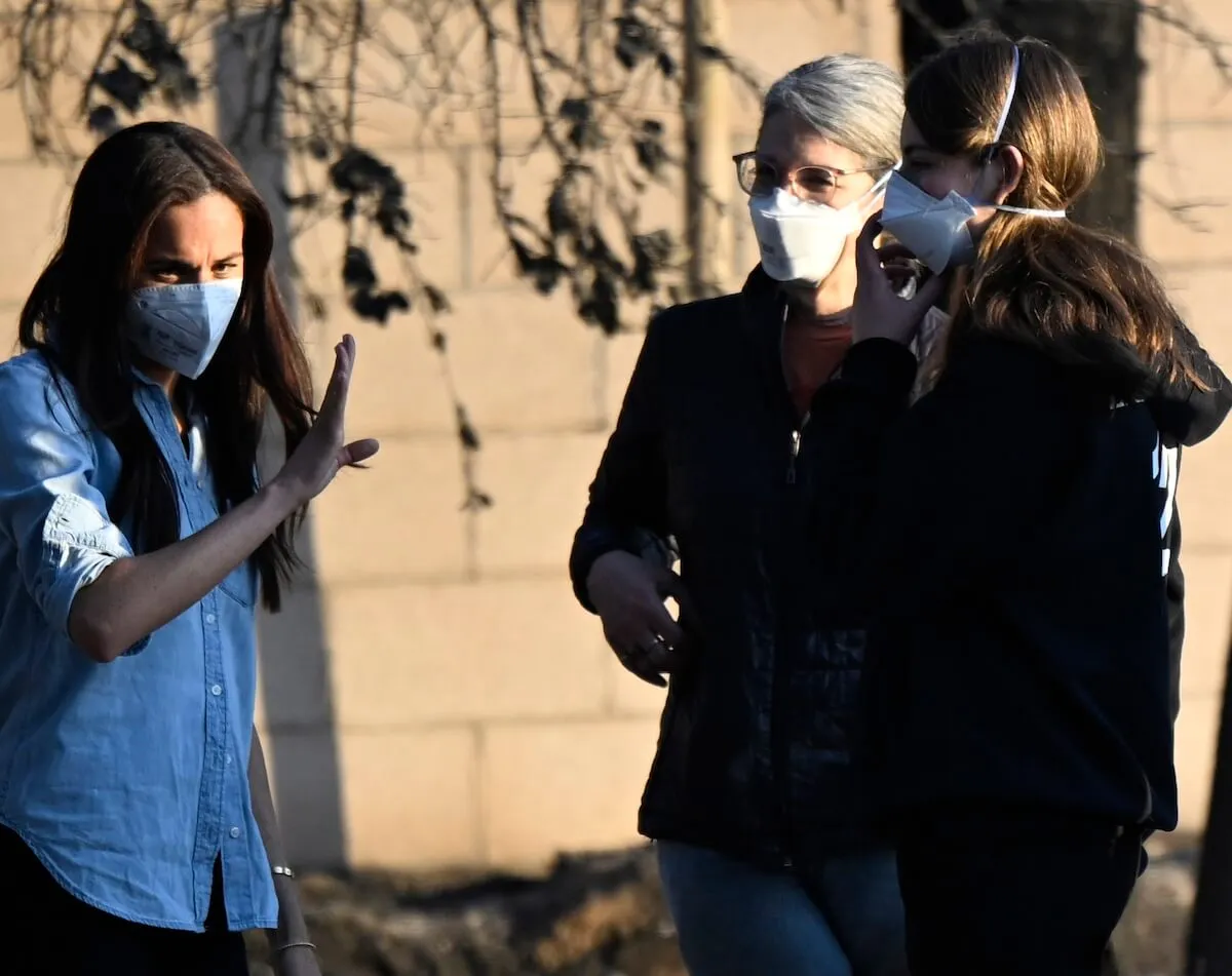 Meghan Markle (left) visits the fire damage in Pasadena, California