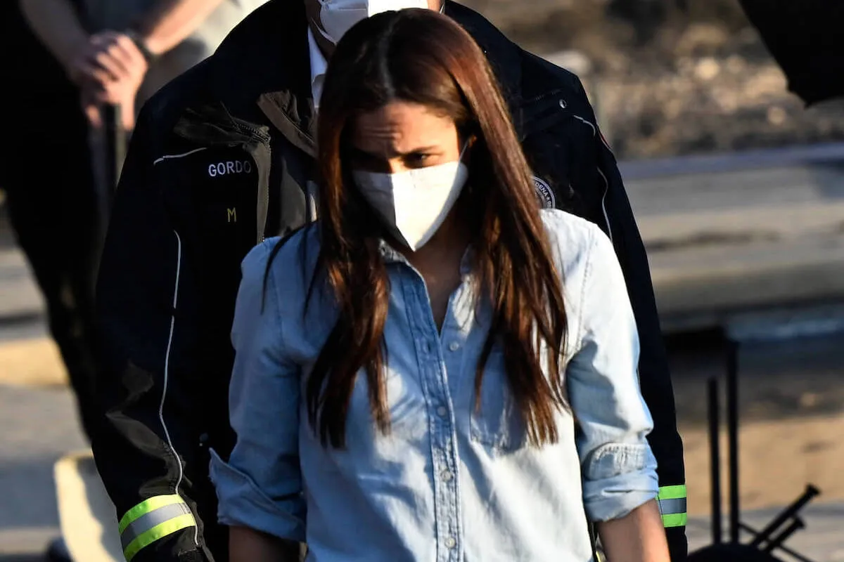 Meghan Markle, who was reportedly deeply hurt by L.A. wildfires criticism, visits first responders and survivors wearing a mask.