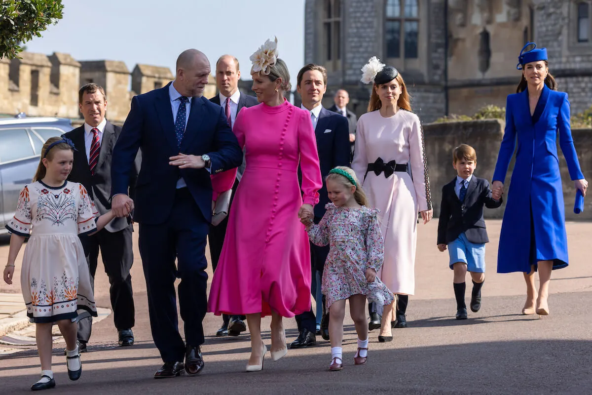 Mike Tindall, Prince William, and other British royals walk together.