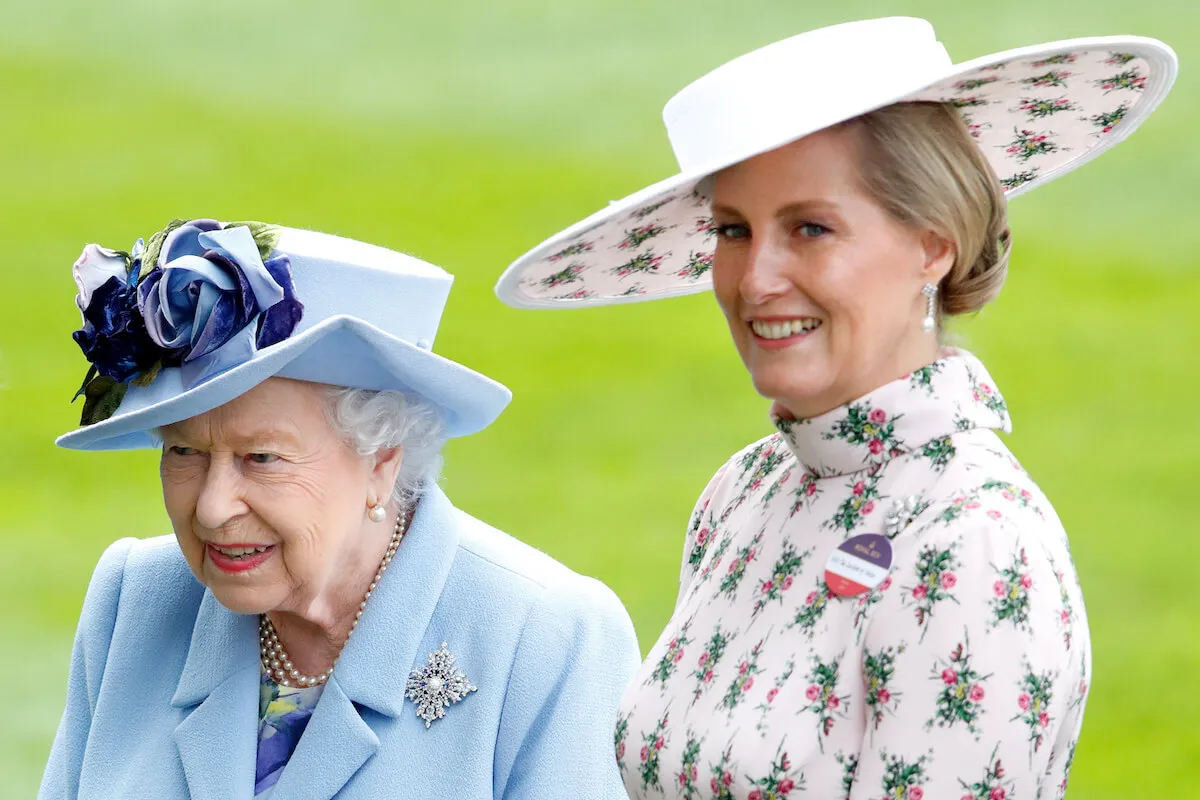 Queen Elizabeth II and Sophie, Duchess of Edinburgh, who had a close relationship, stand next to each other wearing hats.