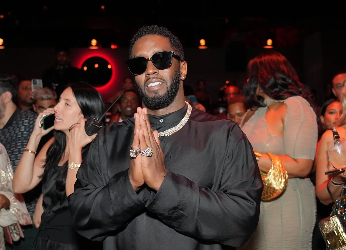 Sean Diddy Combs posing at the BET Lifetime Achievement after party in a black outfit.